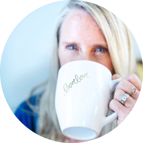 Tanya Mark drinking from a coffee mug that reads LoveLove.